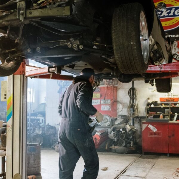 car mechanic under car