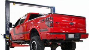 red truck on car lift